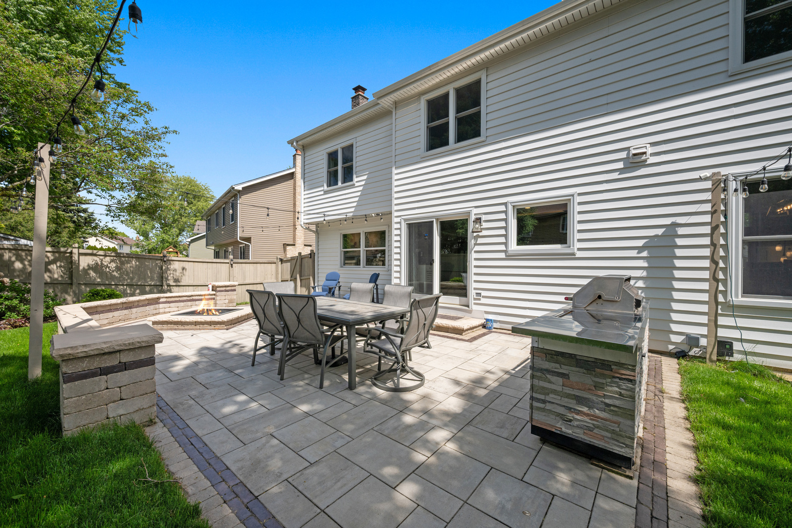 1631 Terri Circle Naperville, IL 60563 - Photo 30 of 39 a view of a patio with table and chairs and wooden fence