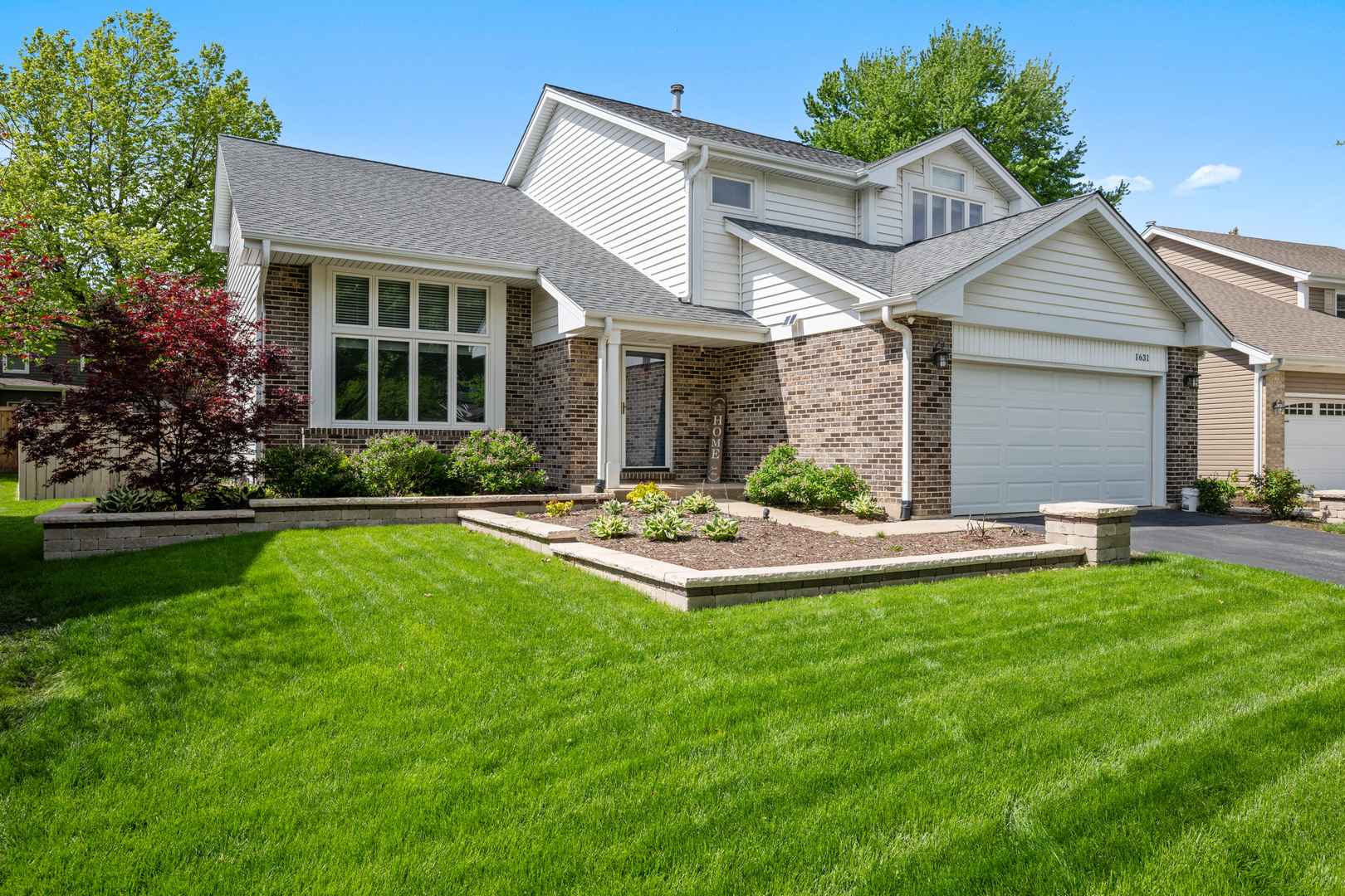 1631 Terri Circle Naperville, IL 60563 - Photo 32 of 39 a view of a house with a yard and a patio