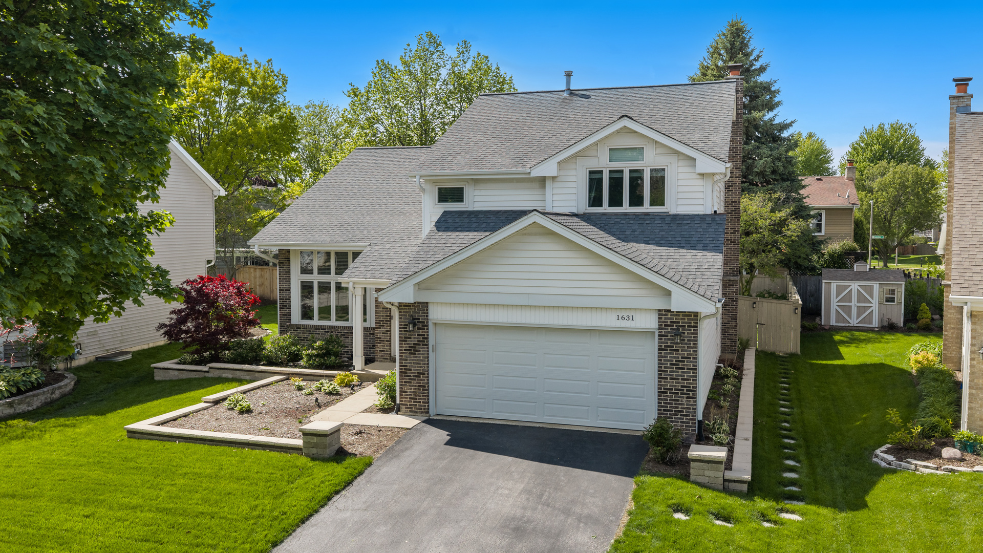 1631 Terri Circle Naperville, IL 60563 - Photo 33 of 39 a front view of house with yard and green space