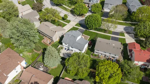 an aerial view of a house with a garden