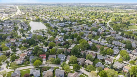 an aerial view of residential houses with outdoor space