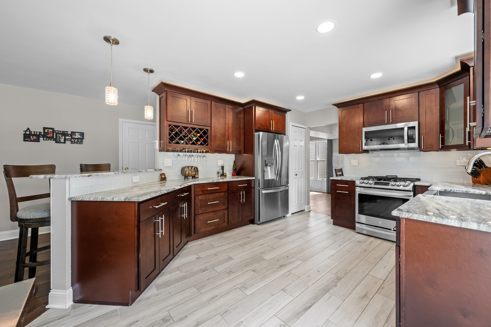 1631 Terri Circle Naperville, IL 60563 - Photo 10 of 39 a large kitchen with stainless steel appliances granite countertop a stove a sink dishwasher a refrigerator and a oven