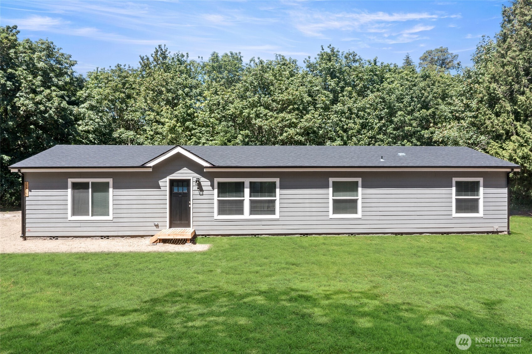17217 80th Street Southwest Longbranch, WA 98351 - Photo 1 of 39 a front view of a house with a garden