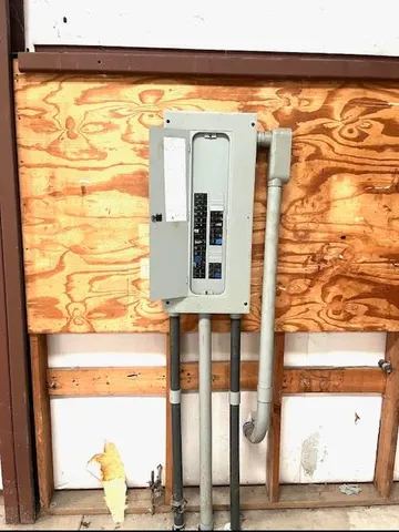 a front view of a house with outdoor seating