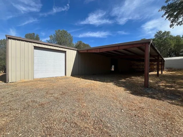 a view of a house with a sink and backyard