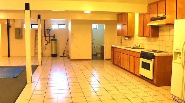 a large bathroom with a tub and shower