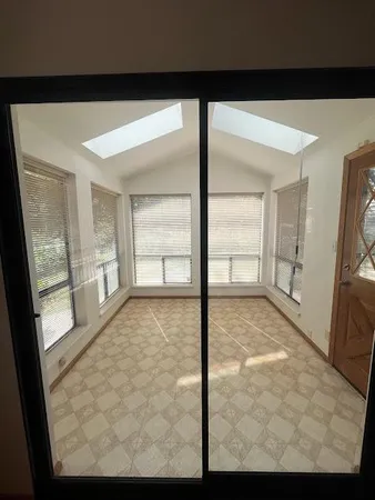 a view of an empty room and window