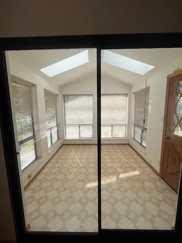 a view of an empty room and window