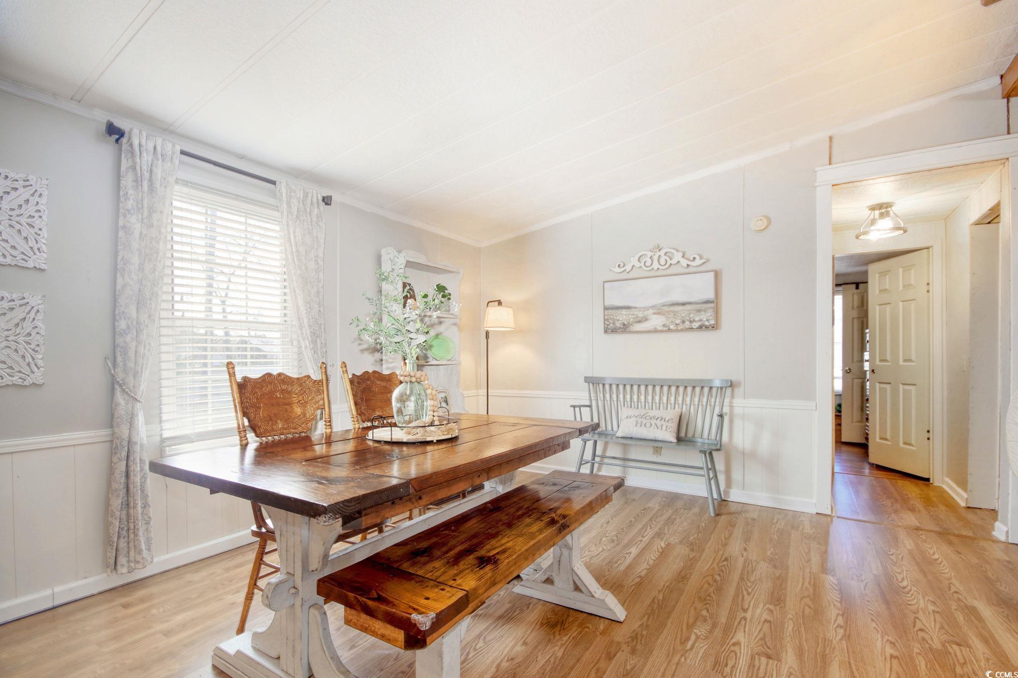 22 Beneventum Road Georgetown, SC 29440 - Photo 8 of 33 Dining room with a wainscoted wall, light wood-sty