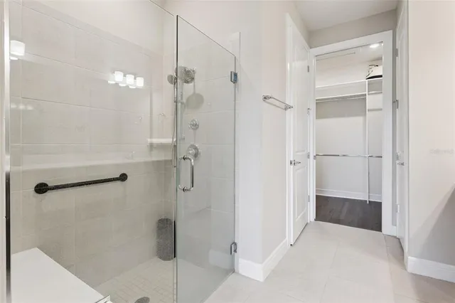 a group of people sitting in front of a house