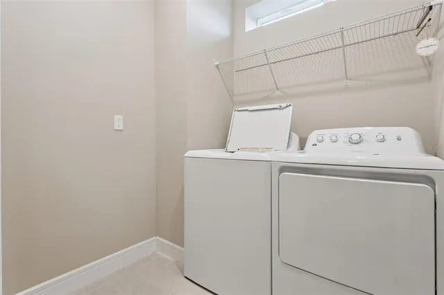 a view of a house with a yard and table