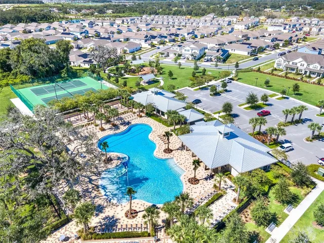 a view of a swimming pool with a table and chairs