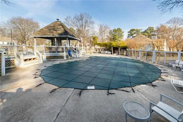 a view of a large white building among the street side
