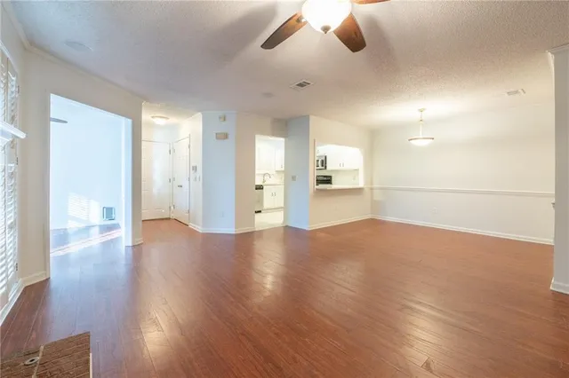 a view of a kitchen with a sink and a refrigerator