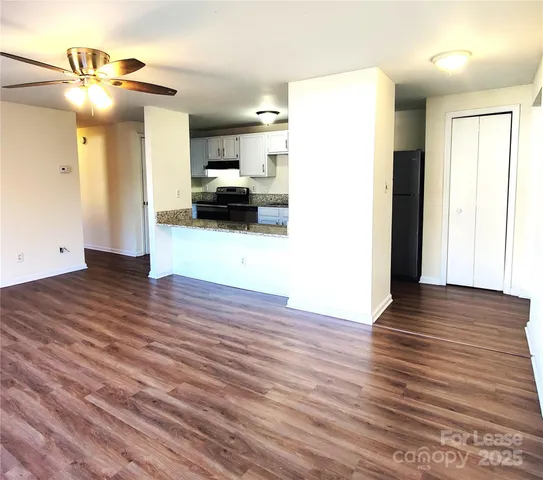 a view of a living room and hardwood floor