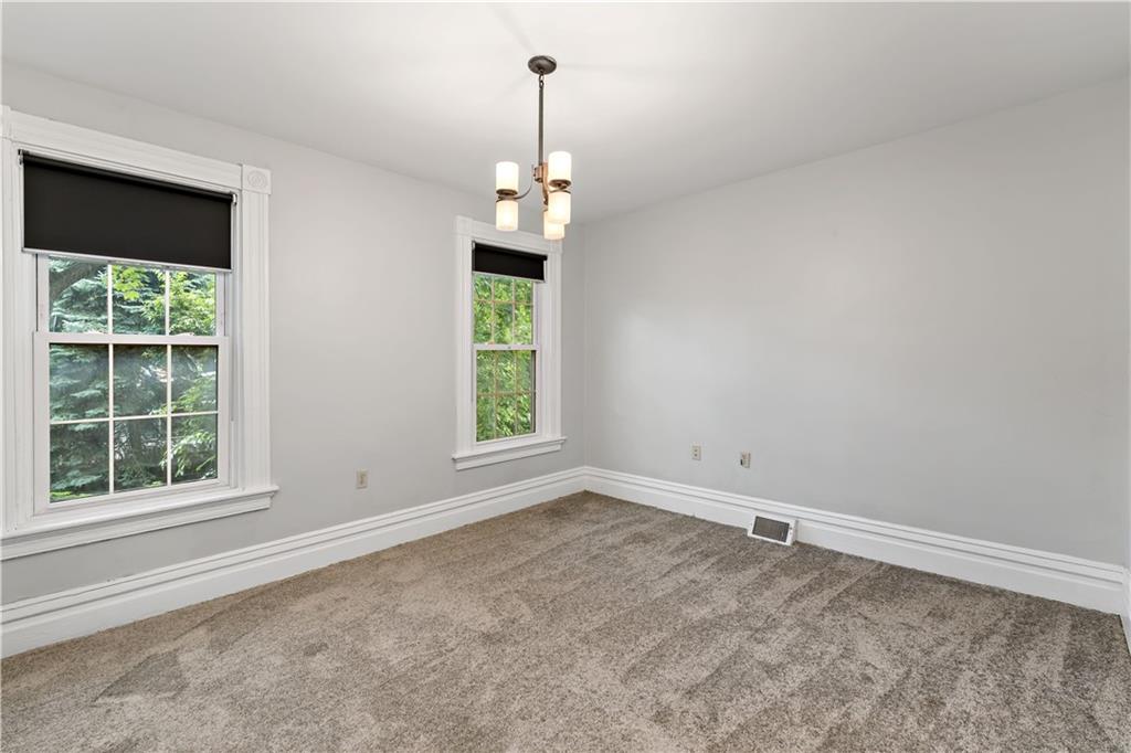 5447 Potter Street Pittsburgh, PA 15232 - Photo 13 of 36 an empty room with windows and outdoor view