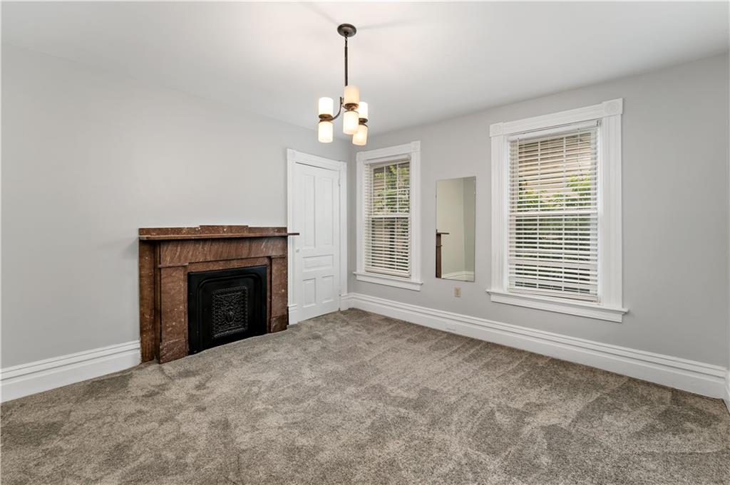 5447 Potter Street Pittsburgh, PA 15232 - Photo 14 of 36 a view of an empty room with a fireplace