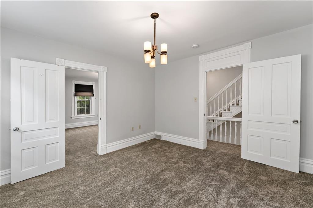 5447 Potter Street Pittsburgh, PA 15232 - Photo 17 of 36 wooden floor in an empty room with a window