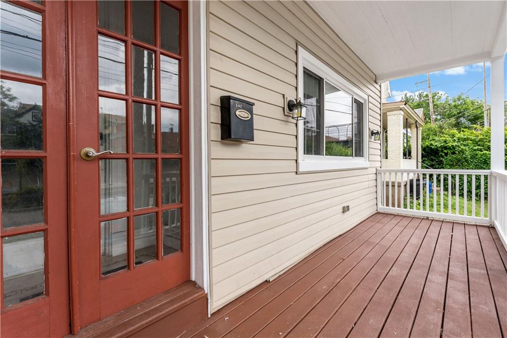 5447 Potter Street Pittsburgh, PA 15232 - Photo 2 of 36 a view of a balcony with wooden floor