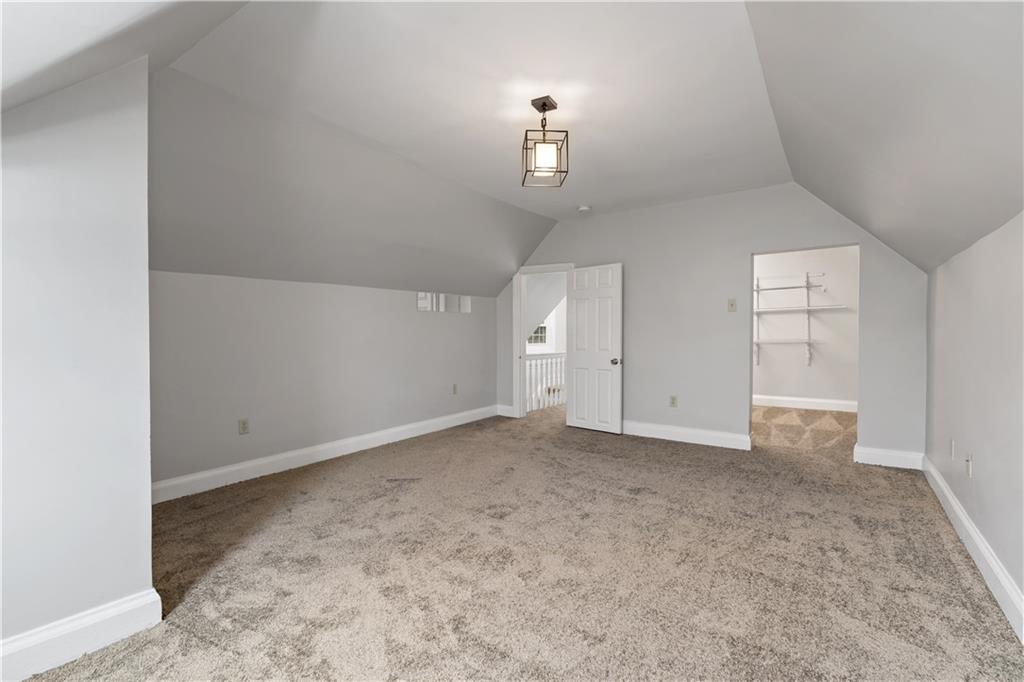 5447 Potter Street Pittsburgh, PA 15232 - Photo 22 of 36 an empty room with chandelier fan and windows