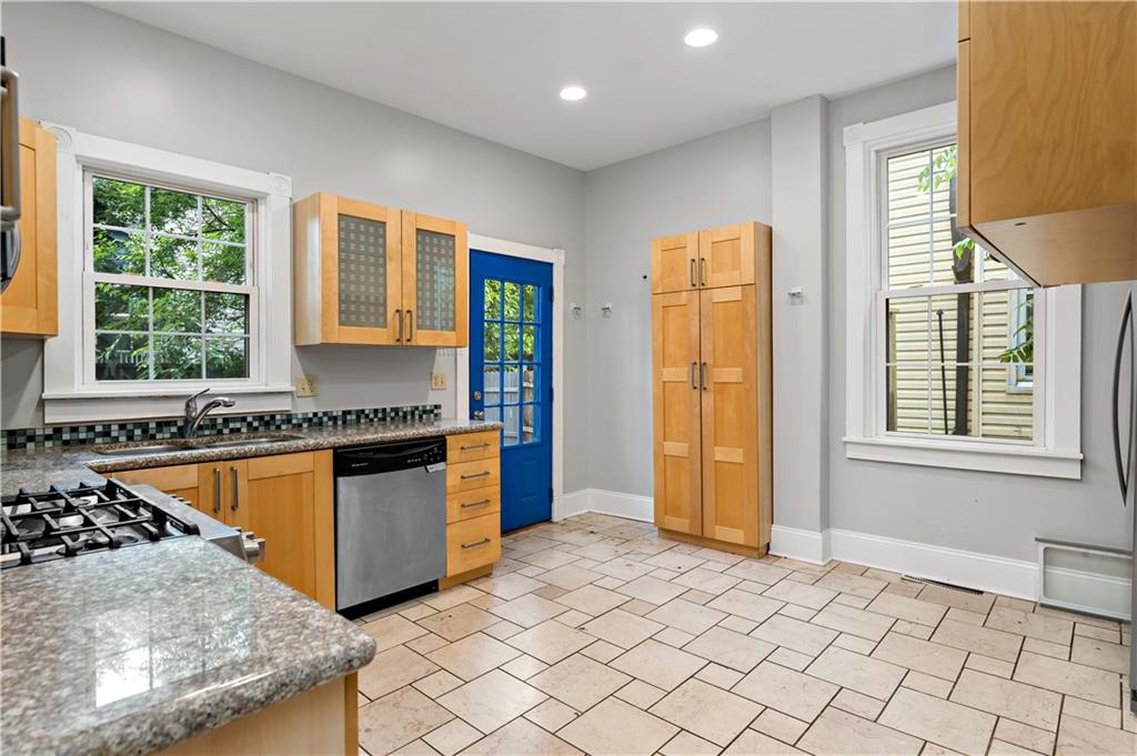 5447 Potter Street Pittsburgh, PA 15232 - Photo 8 of 36 a kitchen with stainless steel appliances granite countertop a stove a sink and a refrigerator