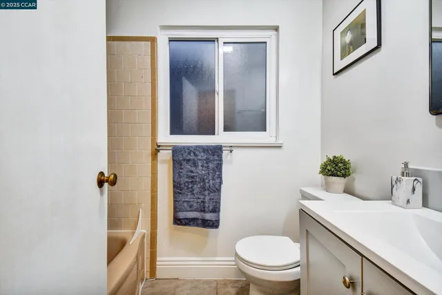 a bathroom with a toilet a sink and shower