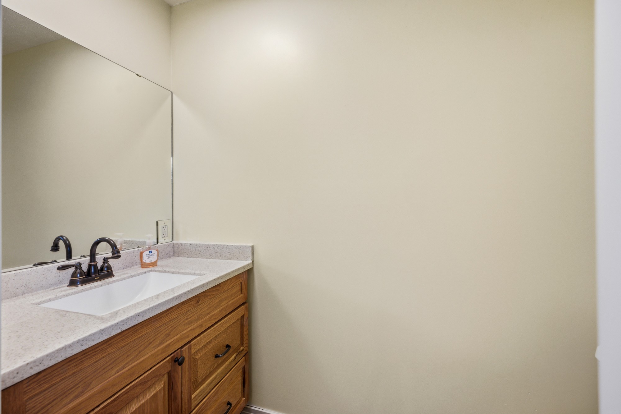 944 Brooksie Thompson Road Decaturville, TN 38329 - Photo 15 of 47 a bathroom with a sink and a mirror