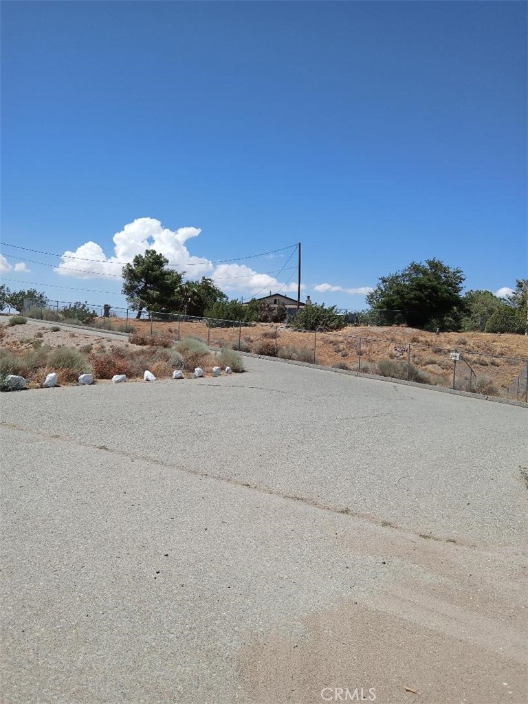 10722 Phelan Road Oak Hills, CA 92344 - Photo 2 of 2 a view of a road with a yard