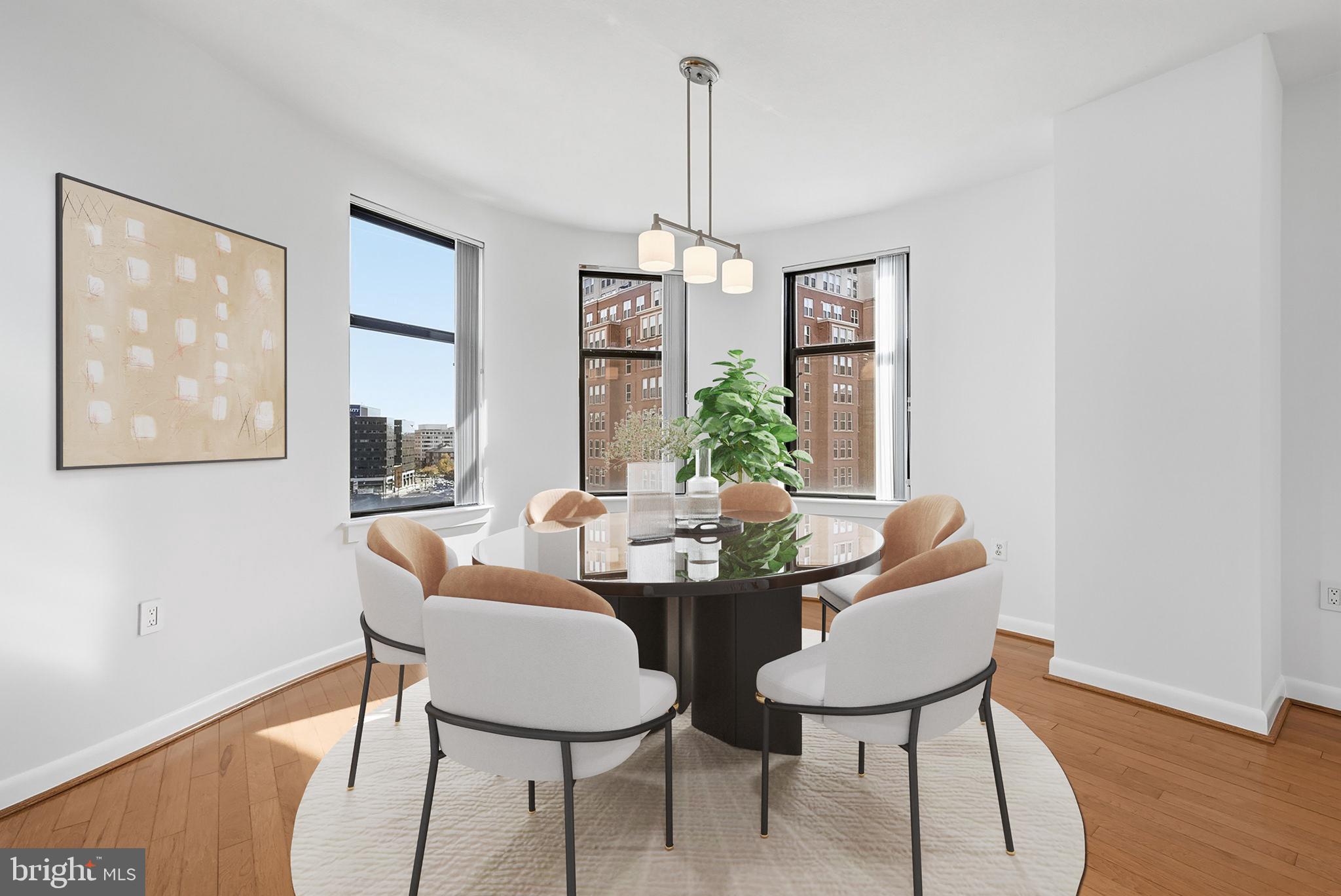 400 Massachusetts Avenue Northwest, Unit 719 Washington, DC 20001 - Photo 11 of 38 a dining room with furniture a chandelier and wooden floor