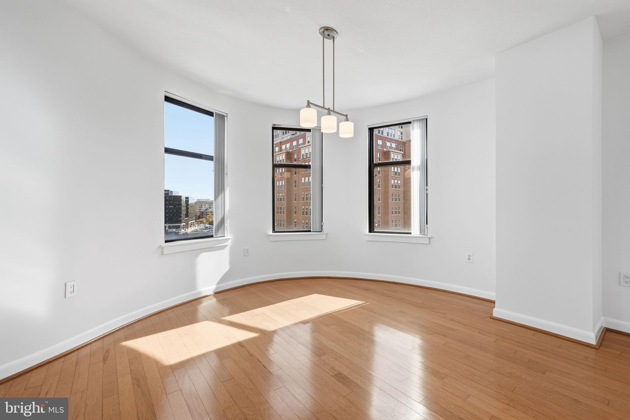 400 Massachusetts Avenue Northwest, Unit 719 Washington, DC 20001 - Photo 12 of 38 a bedroom with bed and a window