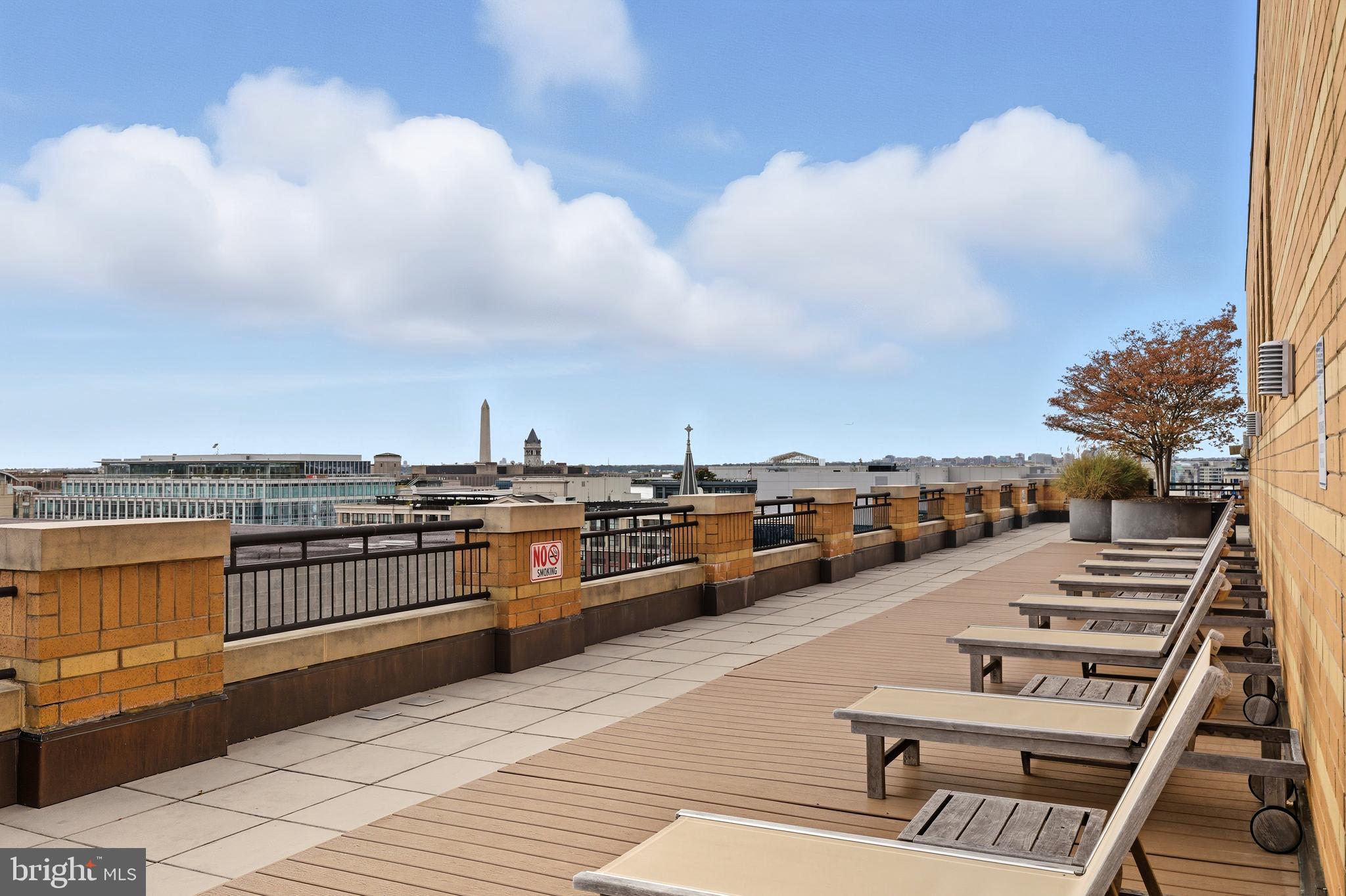 400 Massachusetts Avenue Northwest, Unit 719 Washington, DC 20001 - Photo 32 of 38 a view of a terrace with sitting area