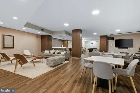 a kitchen with kitchen island stainless steel appliances a stove center island and cabinets