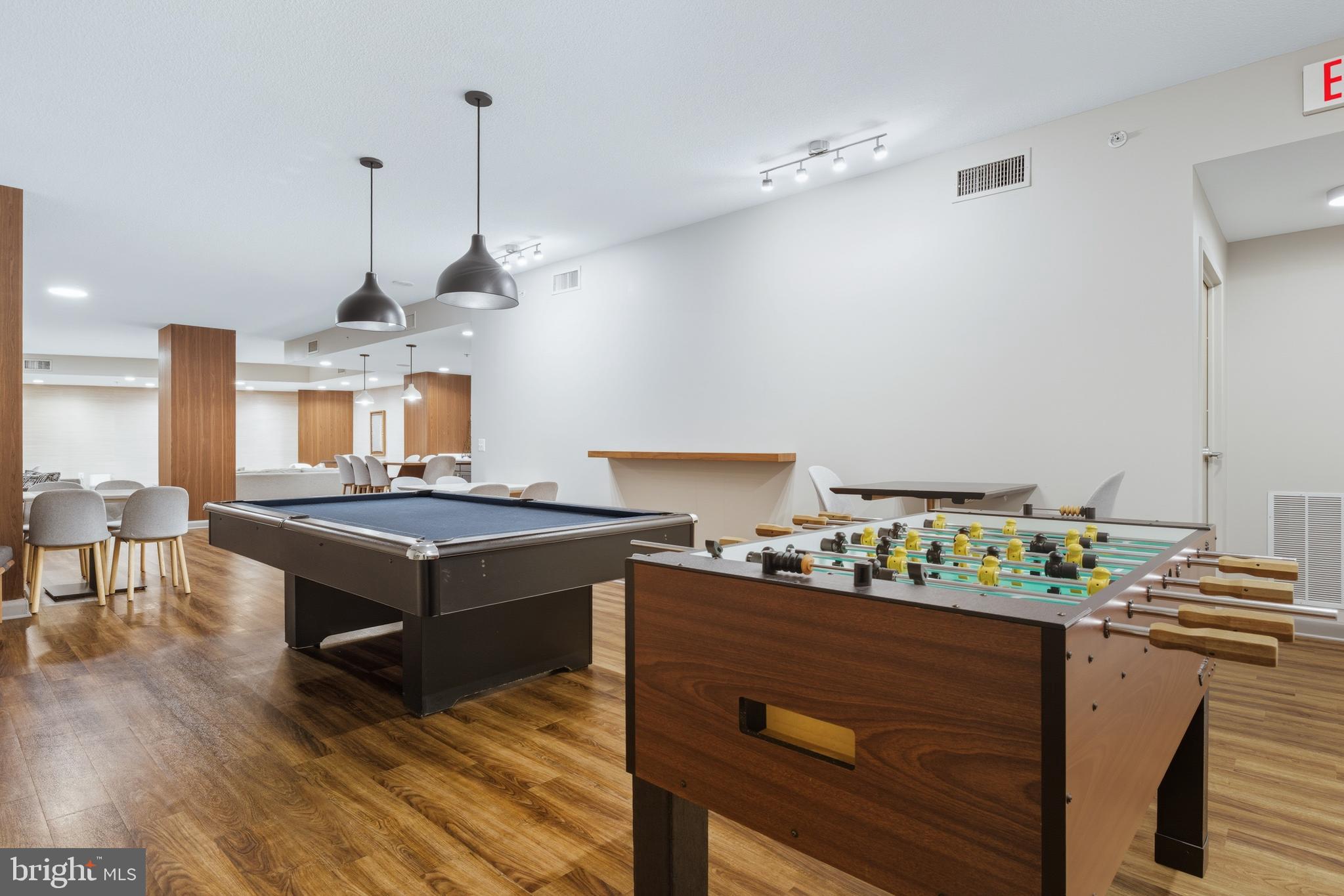 400 Massachusetts Avenue Northwest, Unit 719 Washington, DC 20001 - Photo 37 of 38 a kitchen with kitchen island stainless steel appliances a stove center island and cabinets