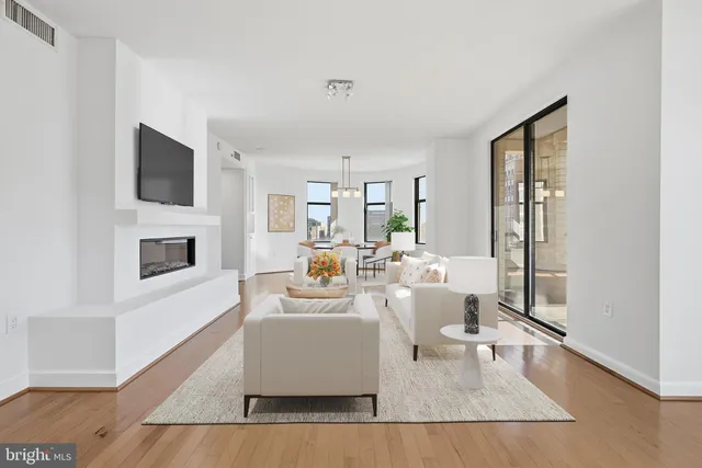 a living room with fireplace furniture and a flat screen tv