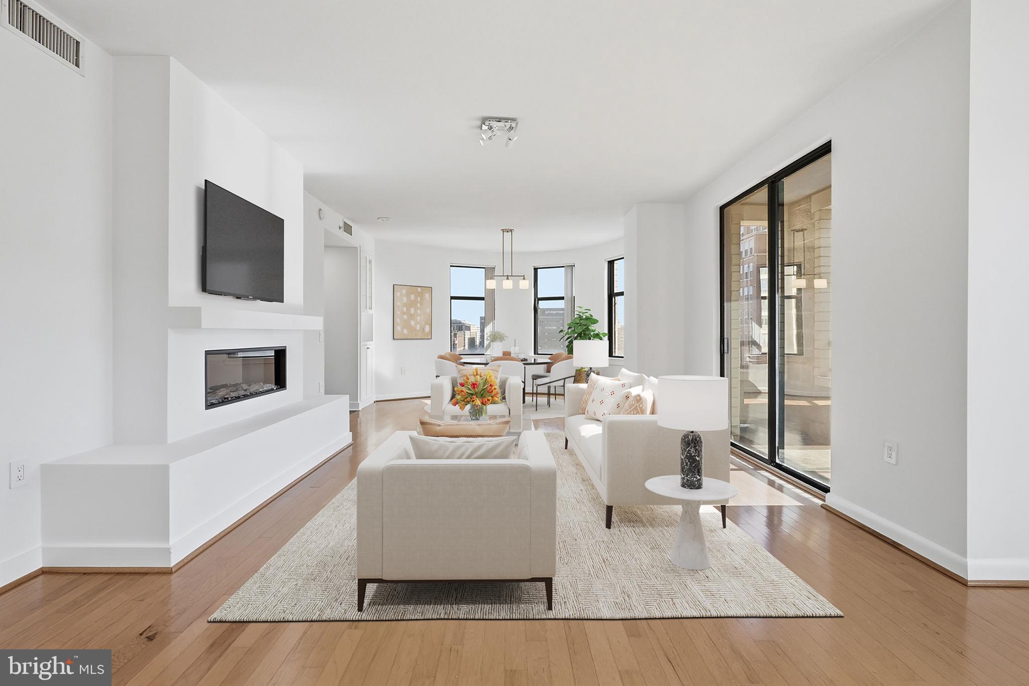 400 Massachusetts Avenue Northwest, Unit 719 Washington, DC 20001 - Photo 6 of 38 a living room with fireplace furniture and a flat screen tv