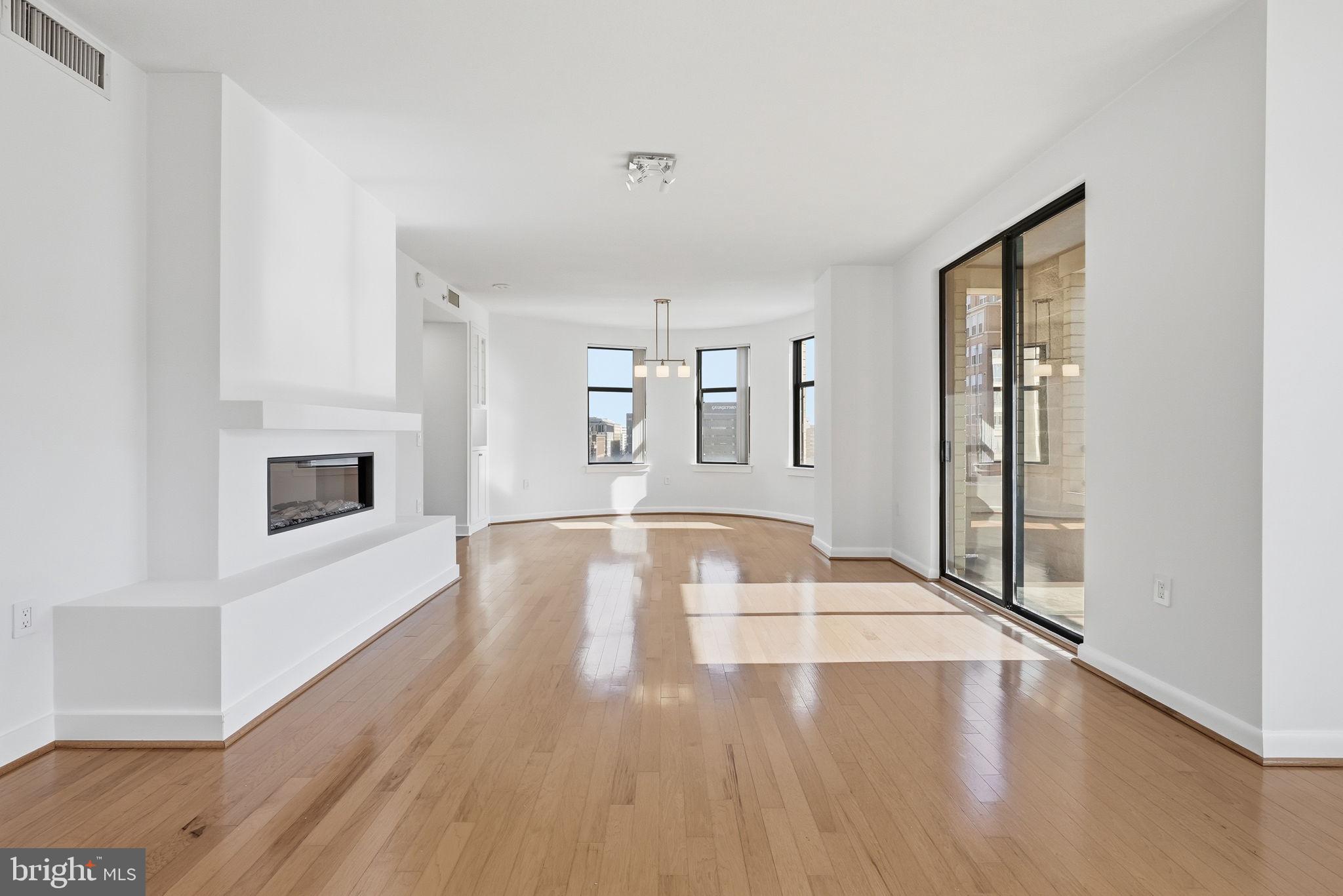 400 Massachusetts Avenue Northwest, Unit 719 Washington, DC 20001 - Photo 7 of 38 a view of livingroom with hardwood floor and window