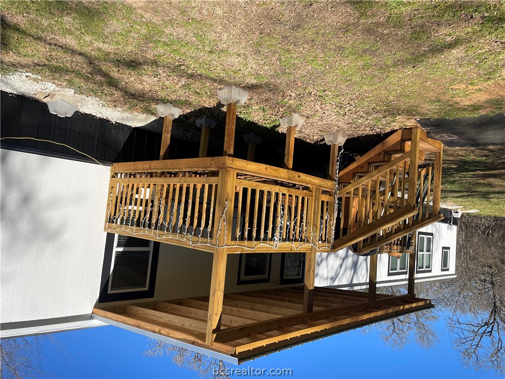 11320 Old Hearne Road Bryan, TX 77807 - Photo 24 of 26 a view of a house with a wooden deck
