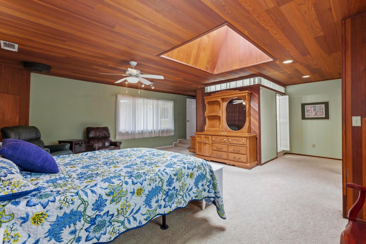 4361 Dresser Road Yuba City, CA 95993 - Photo 14 of 78 a bedroom with a bed a dresser next to a window