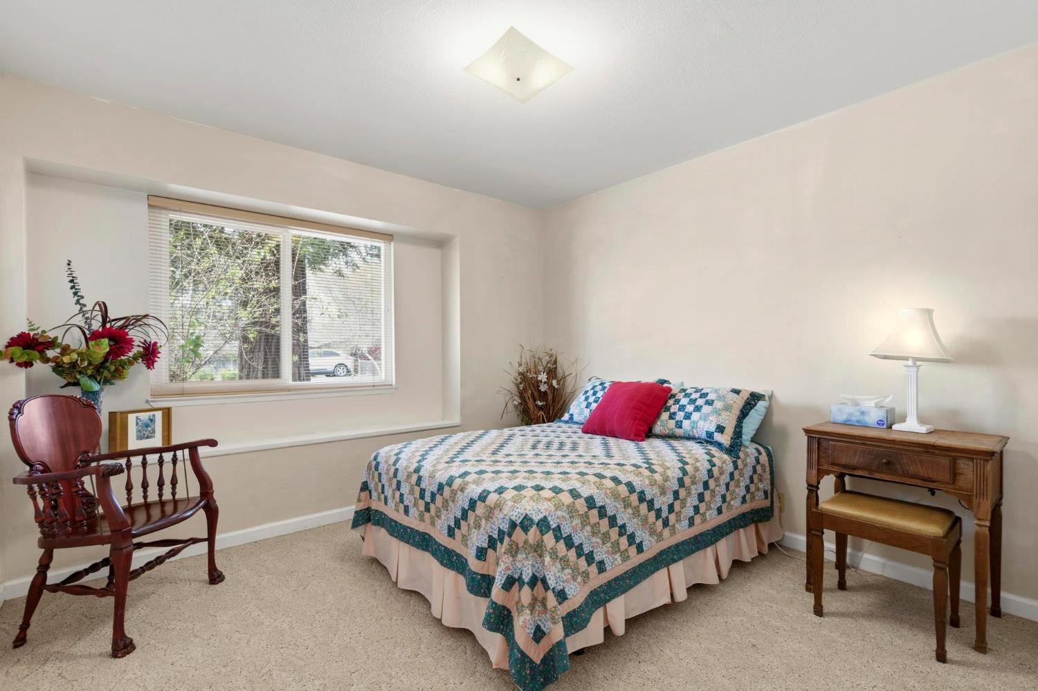 4361 Dresser Road Yuba City, CA 95993 - Photo 19 of 78 a bedroom with a bed and a chair