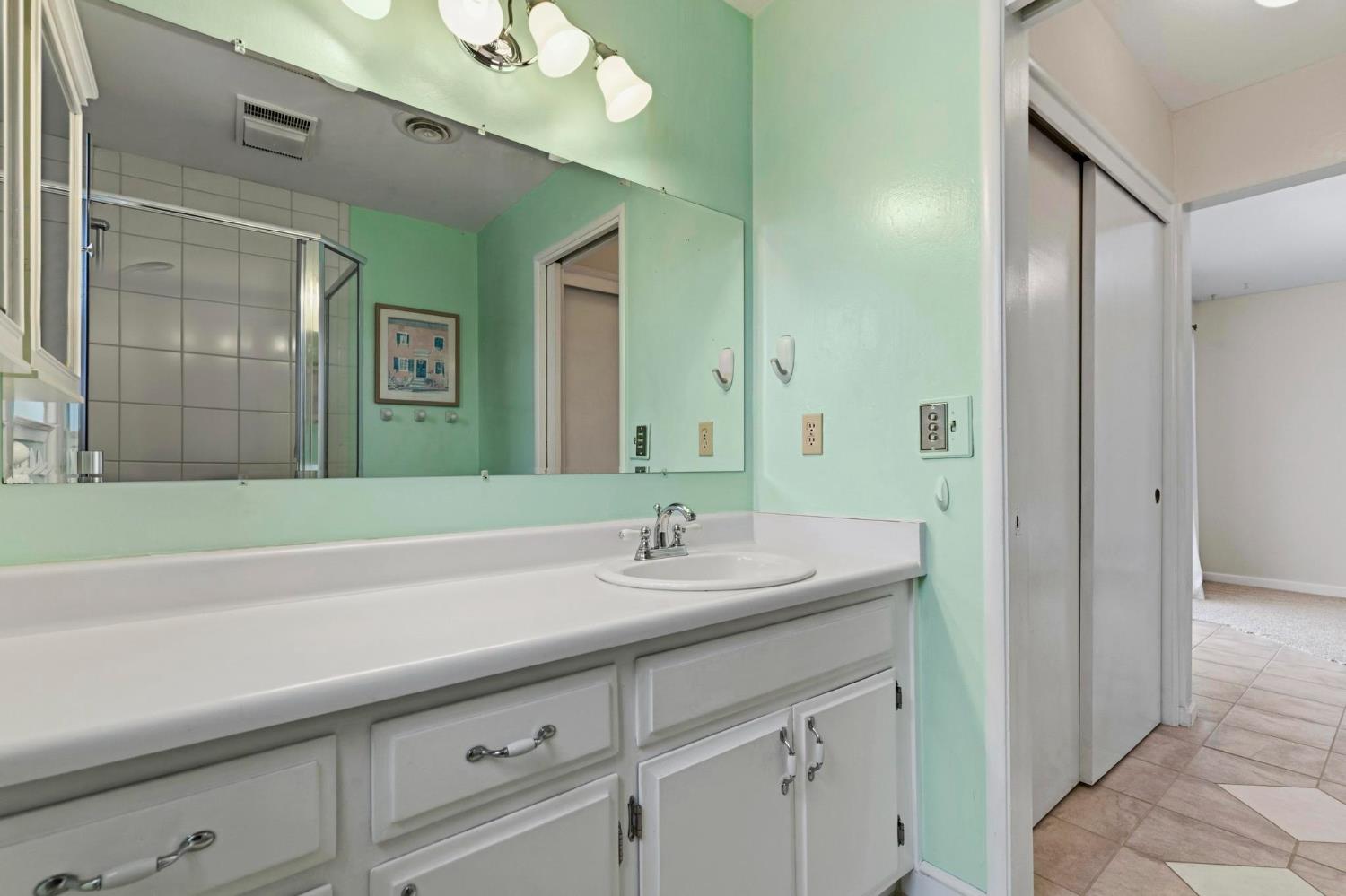 4361 Dresser Road Yuba City, CA 95993 - Photo 23 of 78 a bathroom with a sink and a mirror