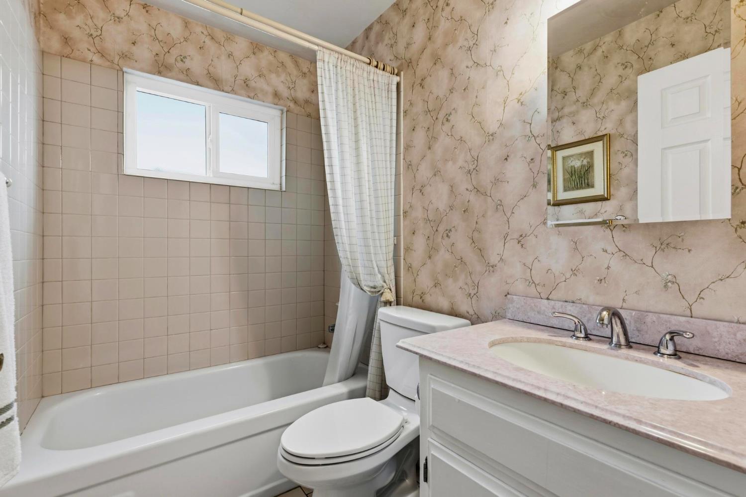 4361 Dresser Road Yuba City, CA 95993 - Photo 25 of 78 a bathroom with a granite countertop toilet a sink and a bathtub