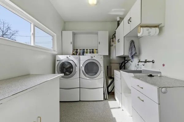 a bathroom with a sink double vanity and a mirror