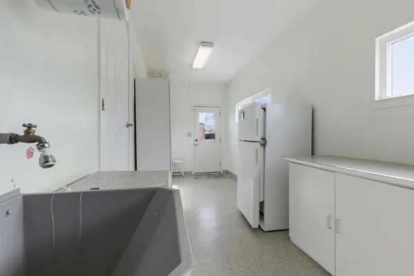 a bathroom with a double vanity sink and mirror