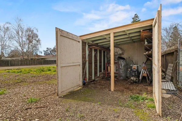 a front view of a house with a yard and a garage