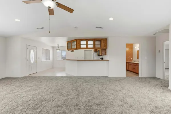 an aerial view of a house with garden space and street view