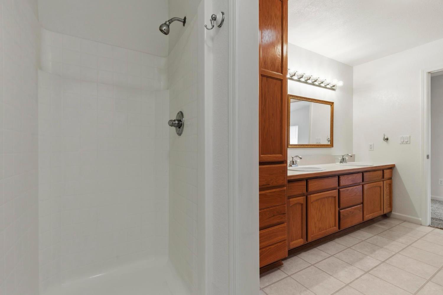 4361 Dresser Road Yuba City, CA 95993 - Photo 53 of 78 a bathroom with a double vanity sink and mirror