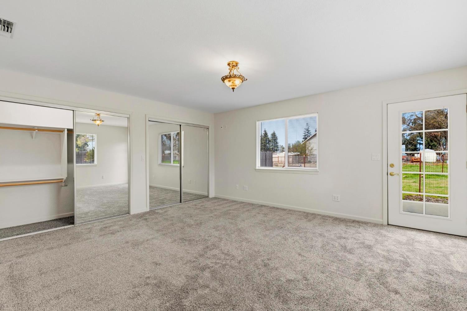 4361 Dresser Road Yuba City, CA 95993 - Photo 54 of 78 an empty room with windows and cabinet