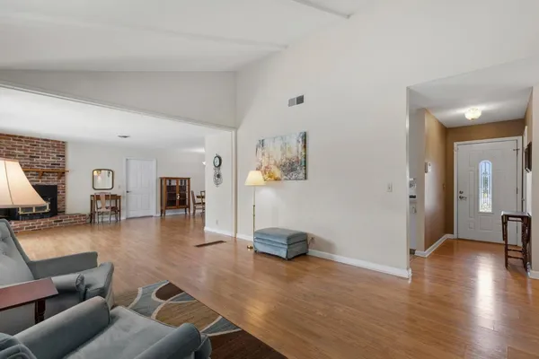 a kitchen with stainless steel appliances a refrigerator a stove a sink and a refrigerator