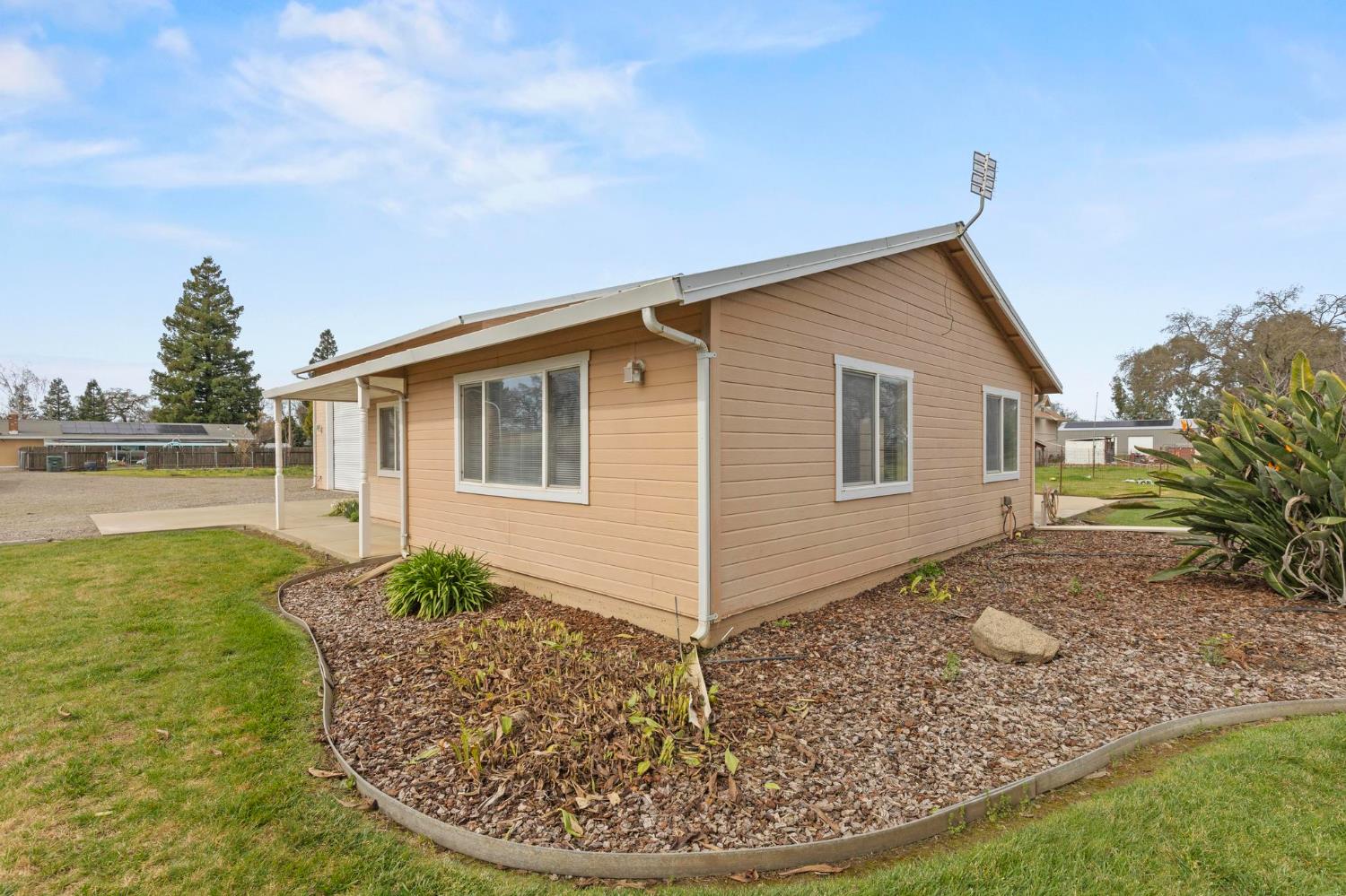 4361 Dresser Road Yuba City, CA 95993 - Photo 61 of 78 a view of a house with backyard porch and sitting area