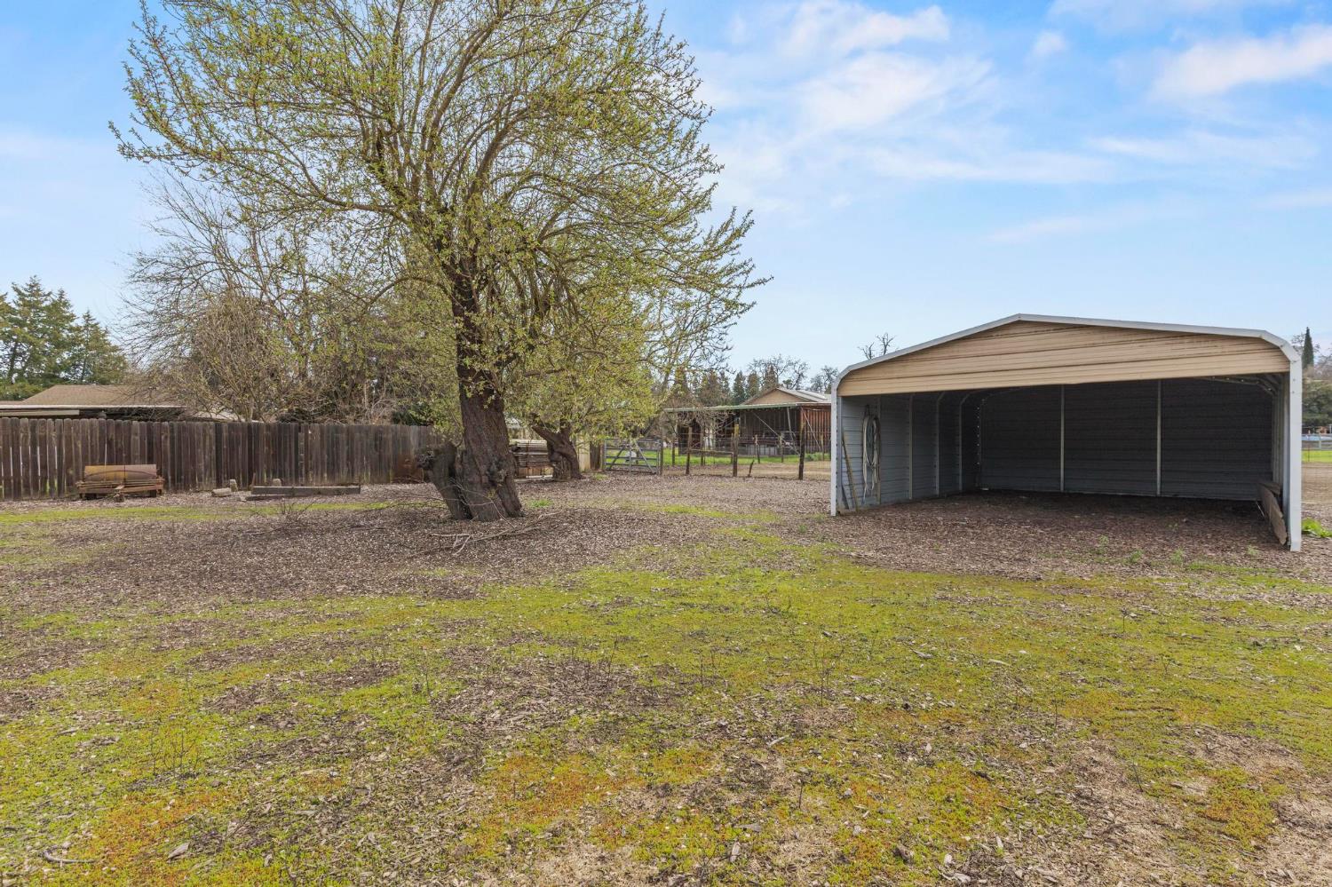 4361 Dresser Road Yuba City, CA 95993 - Photo 64 of 78 a front view of a house with a yard and a garage